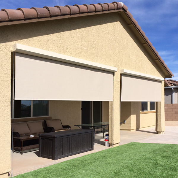 A wide shot of a patio. There are two openings, each with a retractable shade.